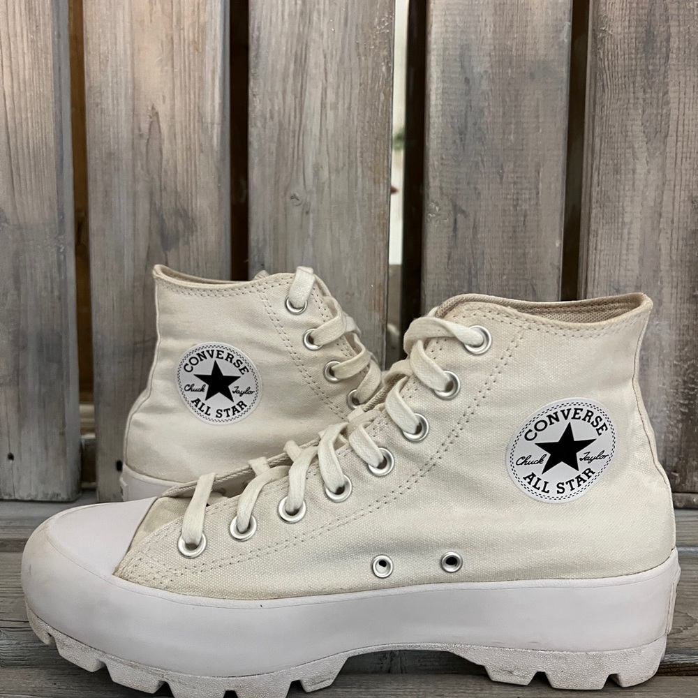 Converse Chuck Taylor women’s white High-Top Sneakers with Rugged Sole